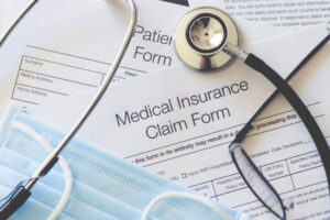 medicaid insurance form with surgical mask and glasses hollis laidlaw & simon mount kisco ny elder law medicaid planning trust & estate planning