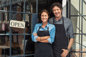 couple in front of newly-opened small business store