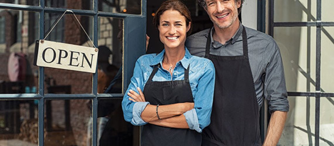 couple in front of newly-opened small business store